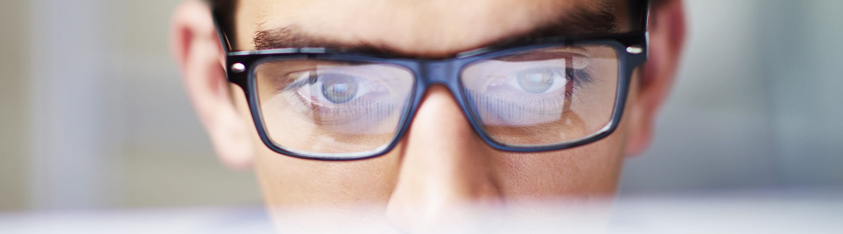 man looking at computer screen