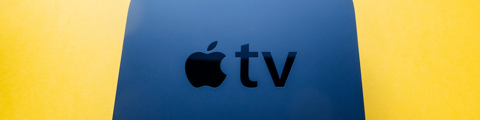 Apple TV on yellow field
