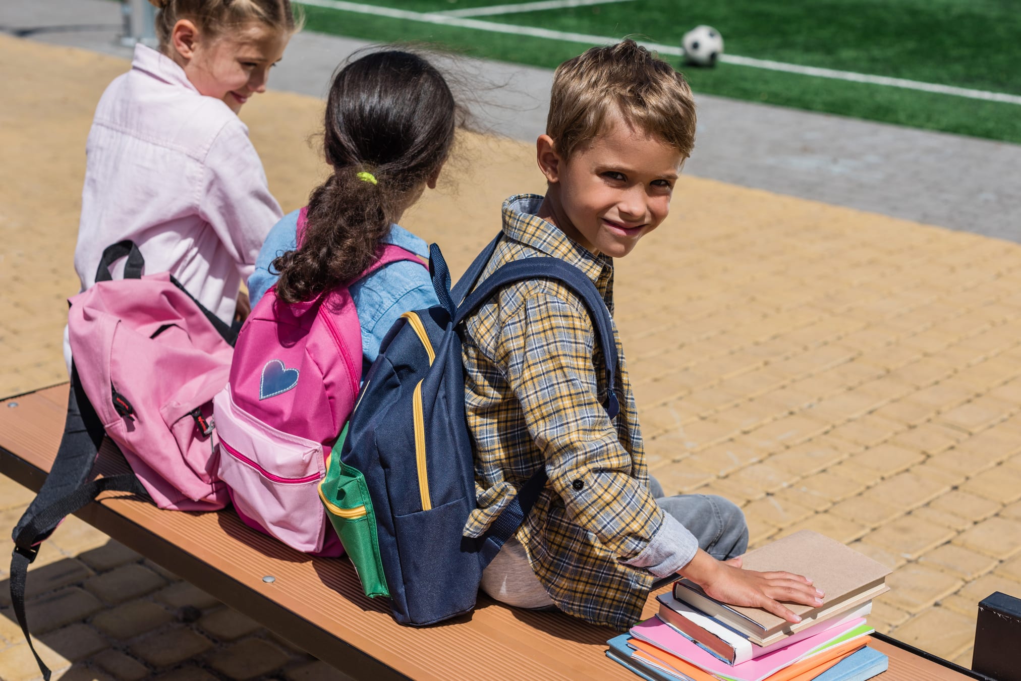 School_Kids_Resting_on_a_Bench.jpg