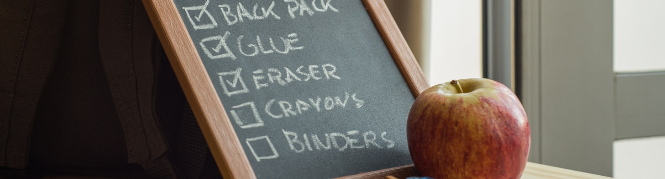 school supply list on chalkboard