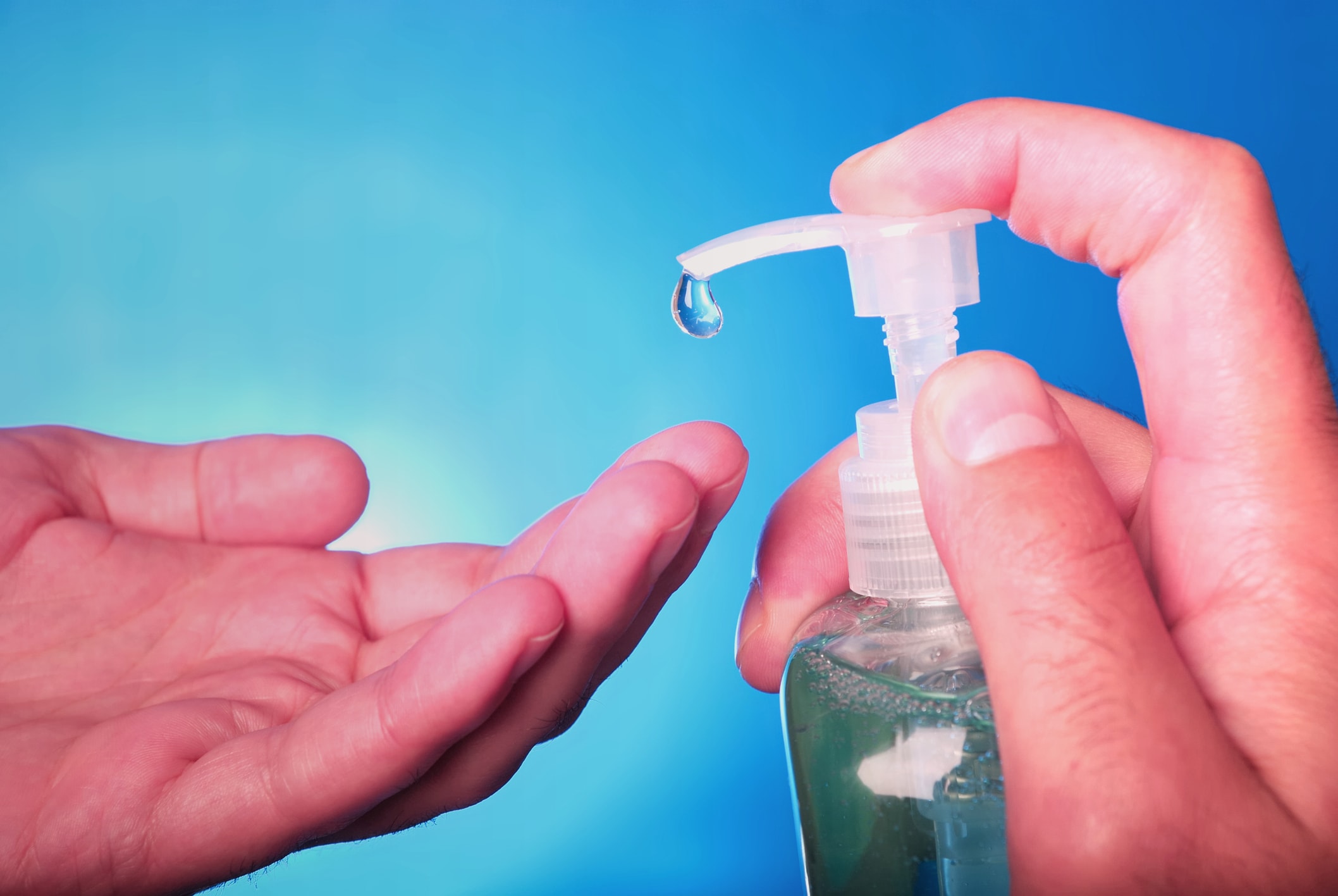 using hand sanitizer