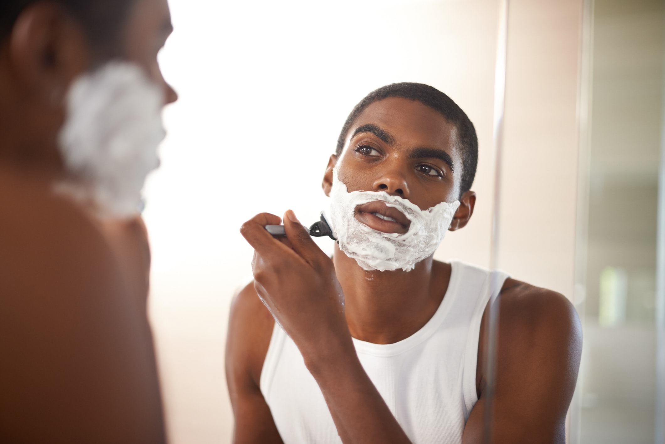 man shaving face