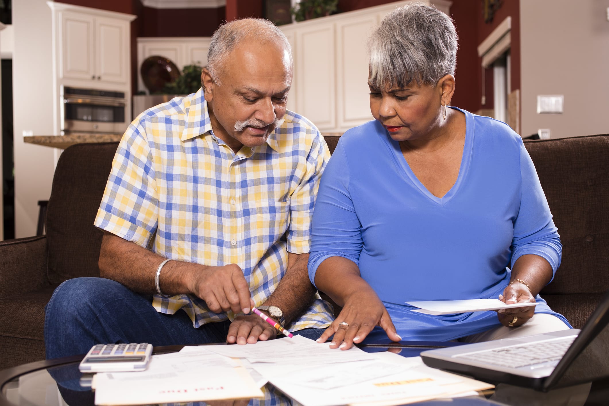 Couple Looking at Bills