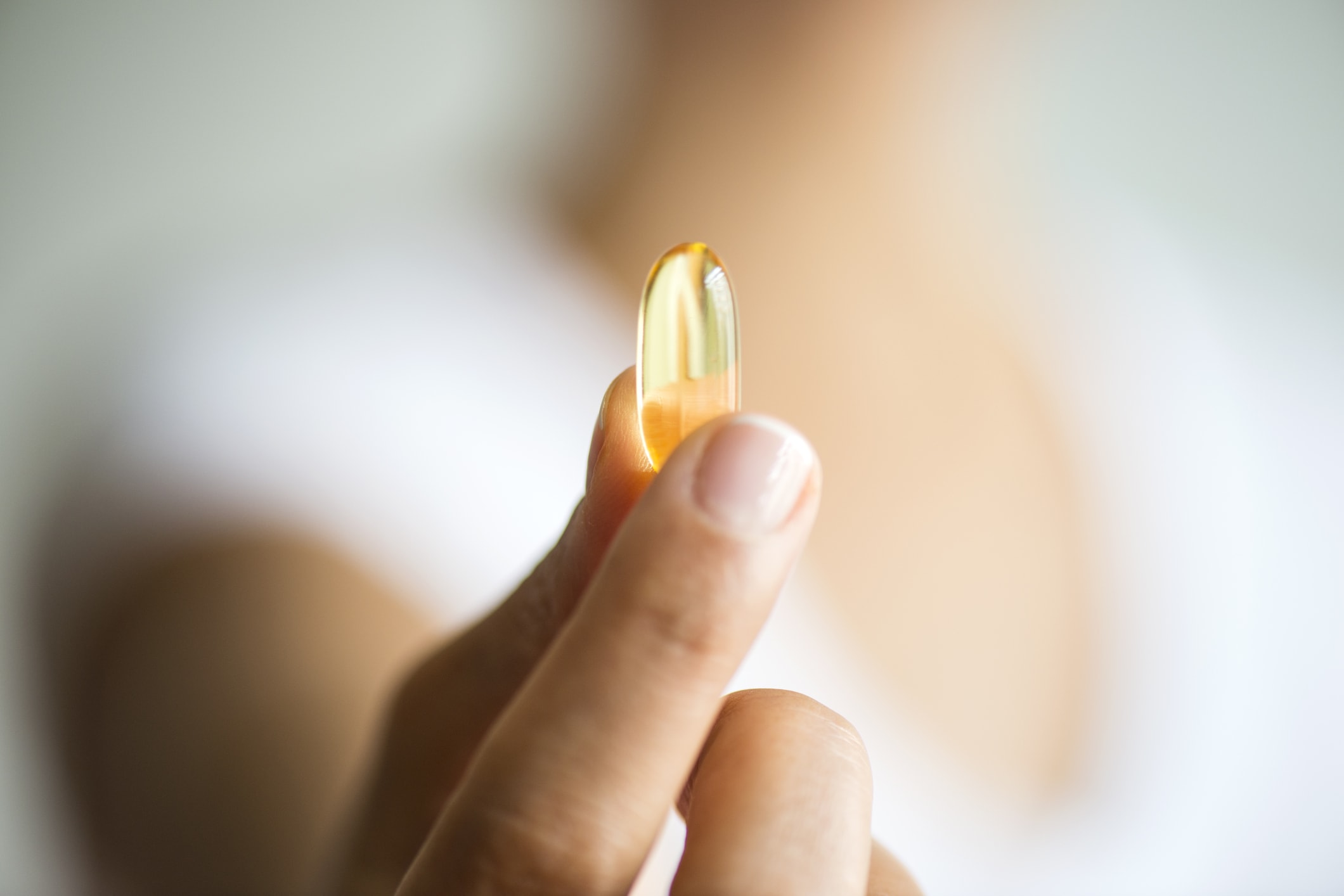 person holding pill