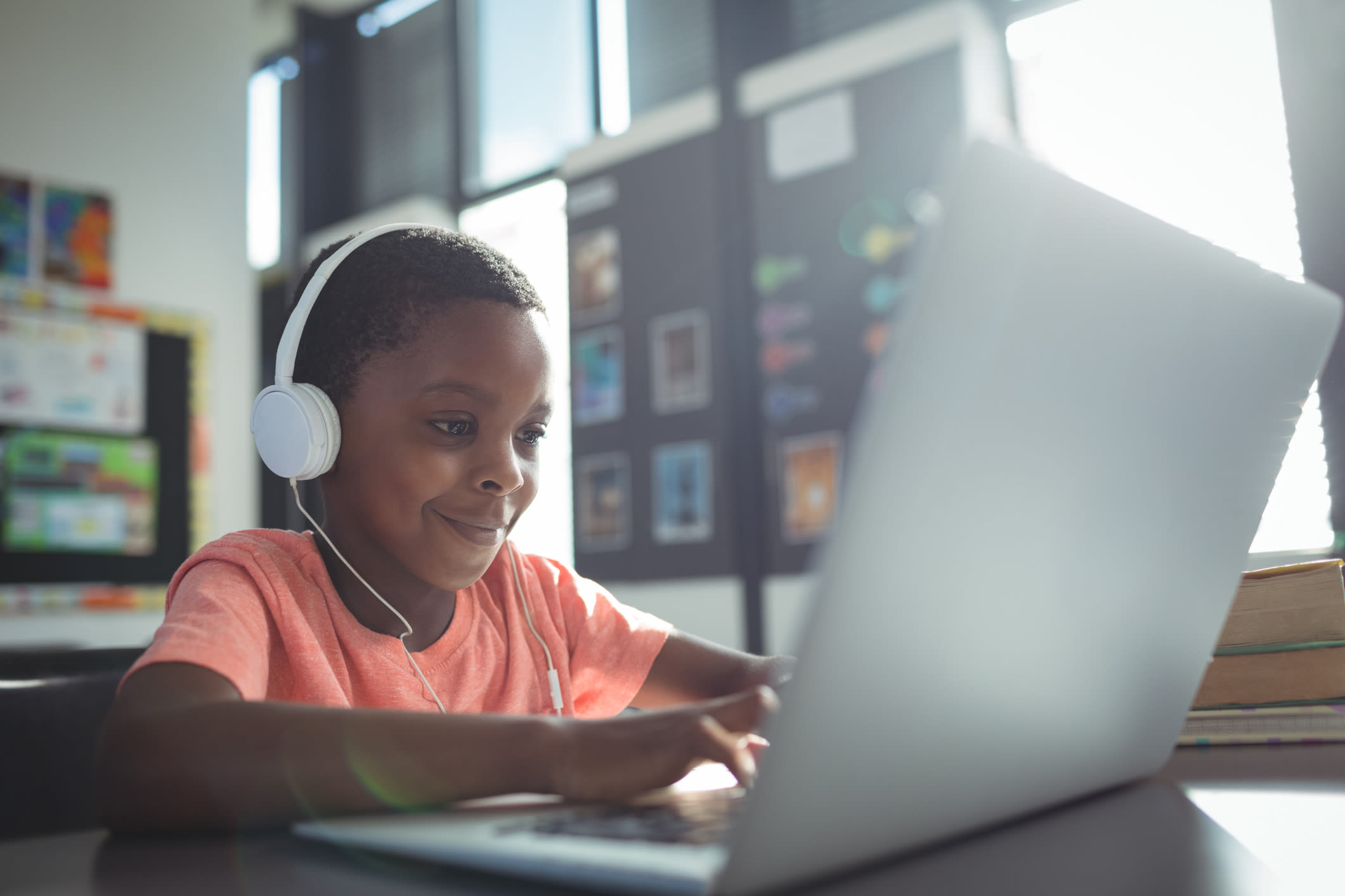 boy on laptop in class