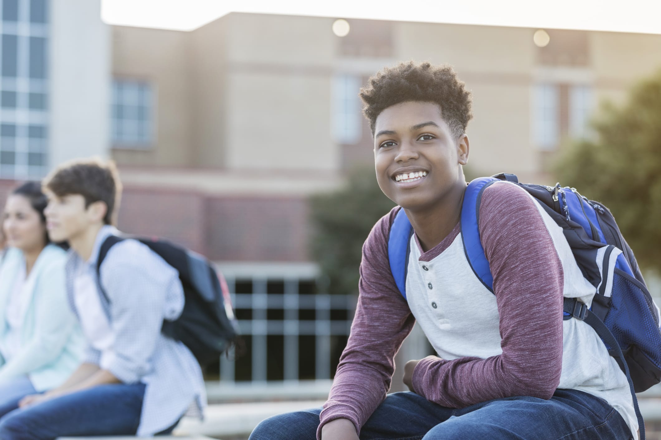male student wearing backpack