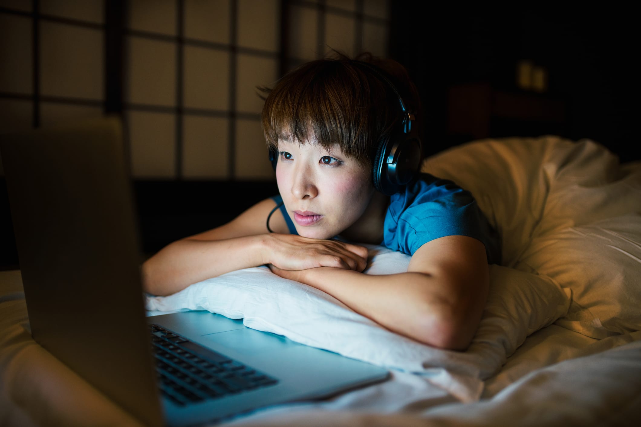 Woman streaming TV on laptop