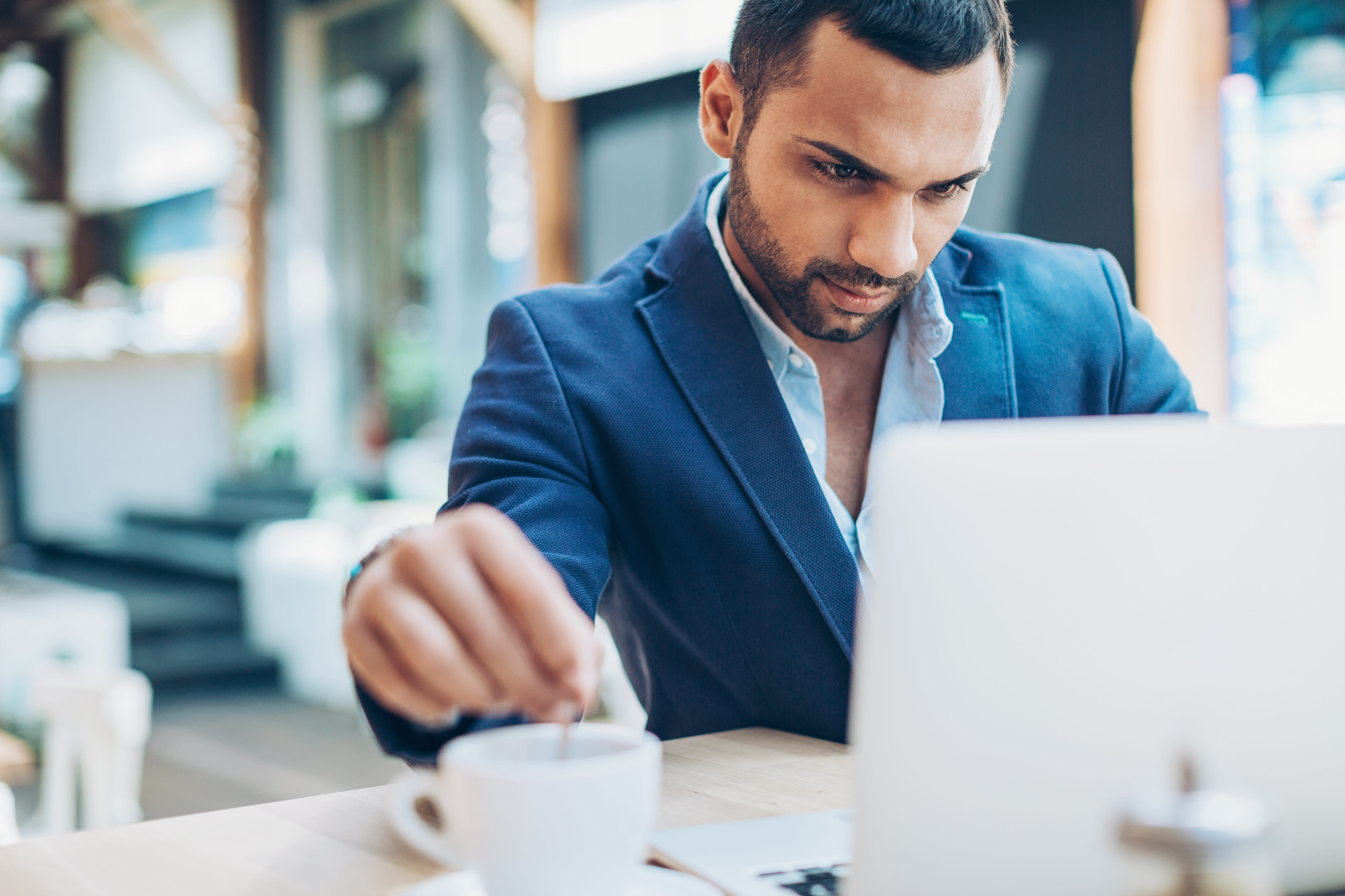 Man researching on laptop