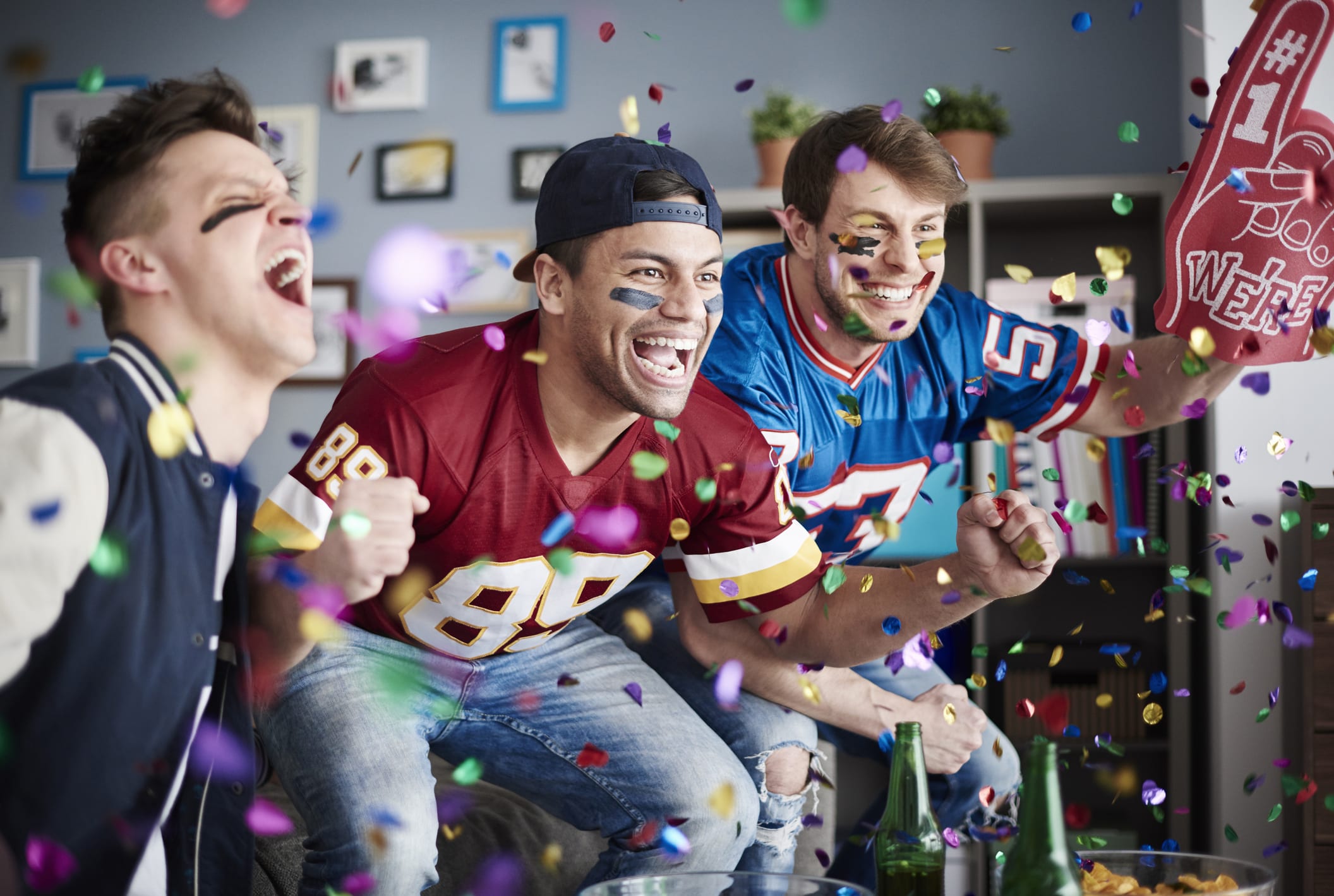 men cheering football game