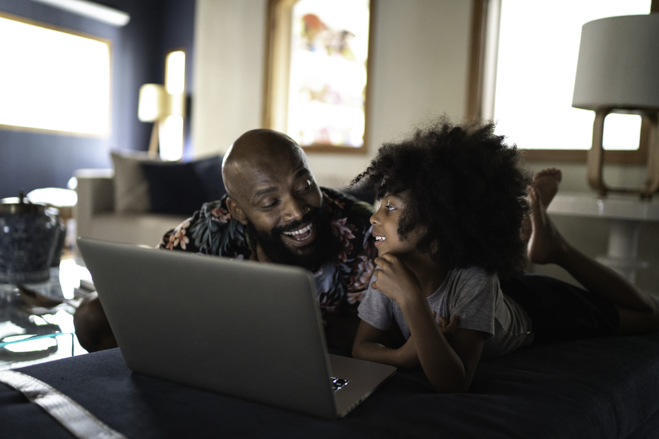 father and daughter with laptop
