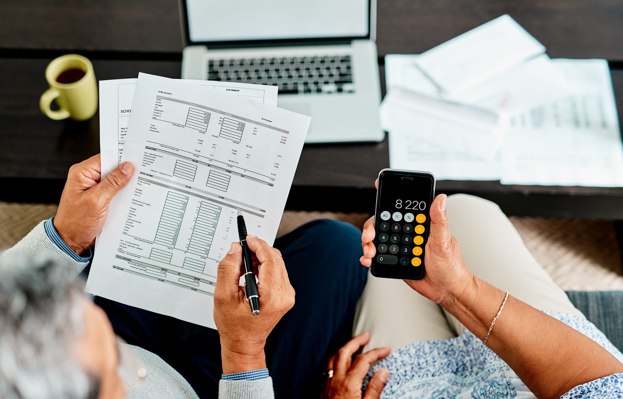 Couple Calculating Their Finances Together at Home