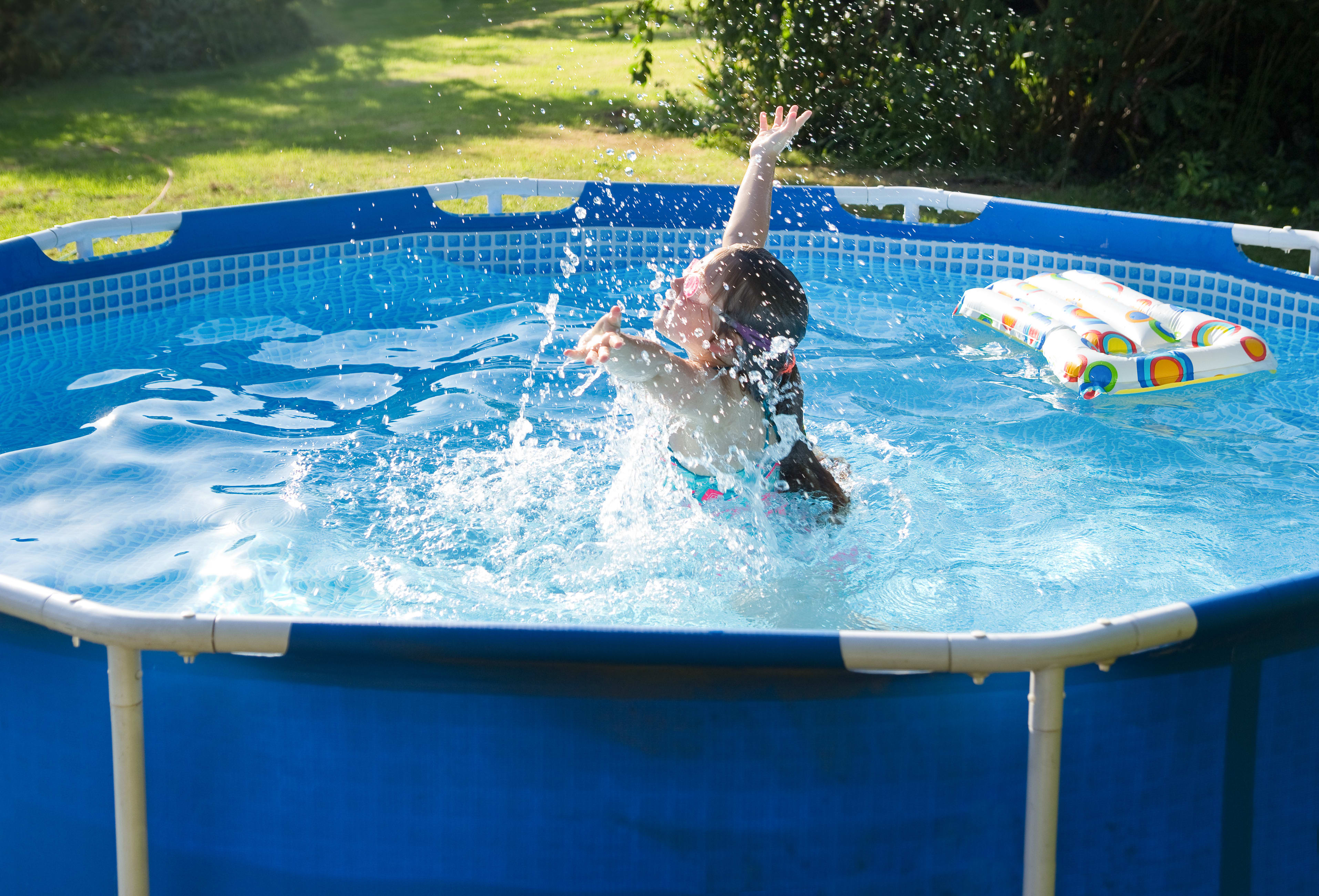 person splashing in pool