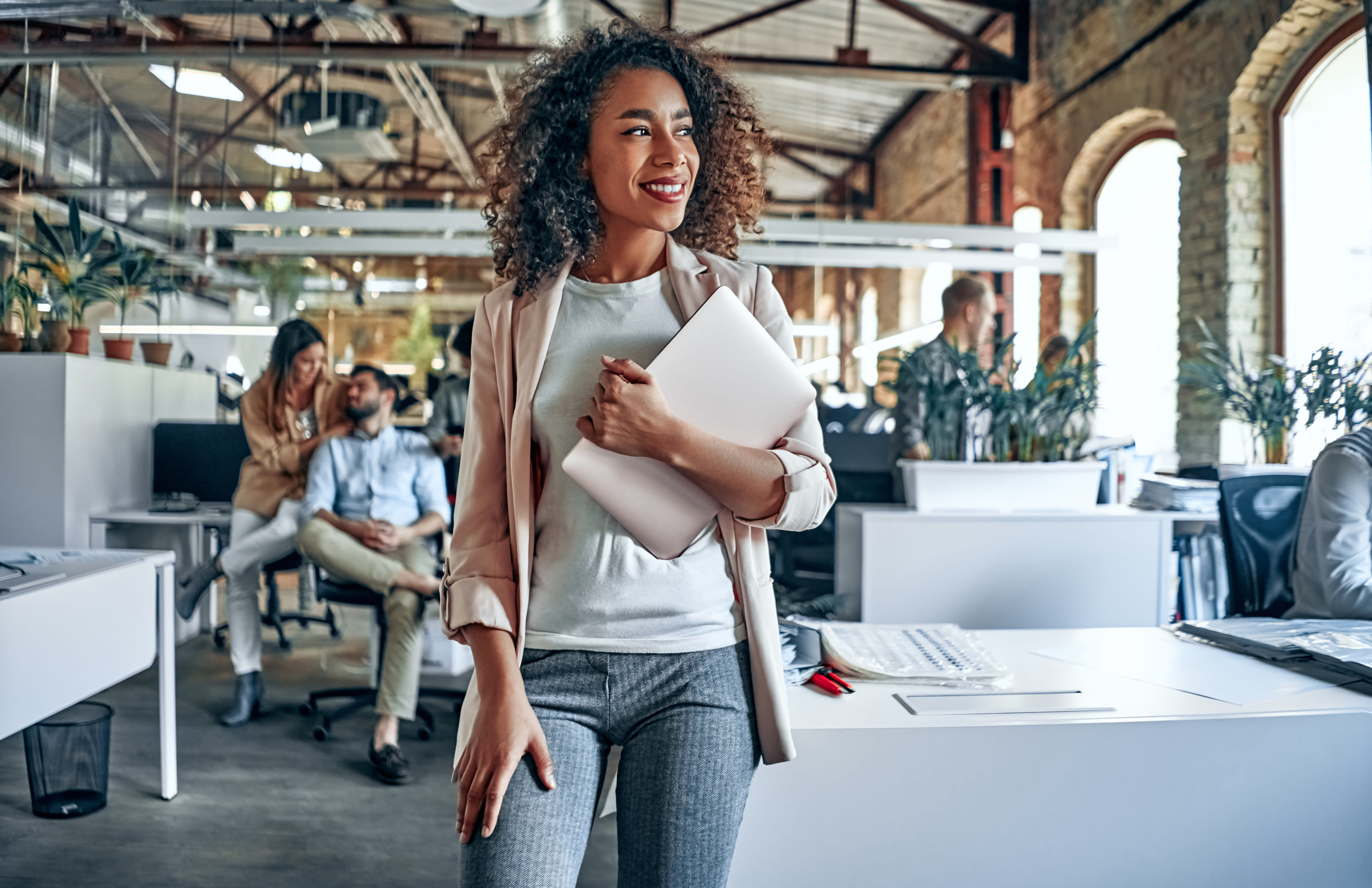 woman holding laptop