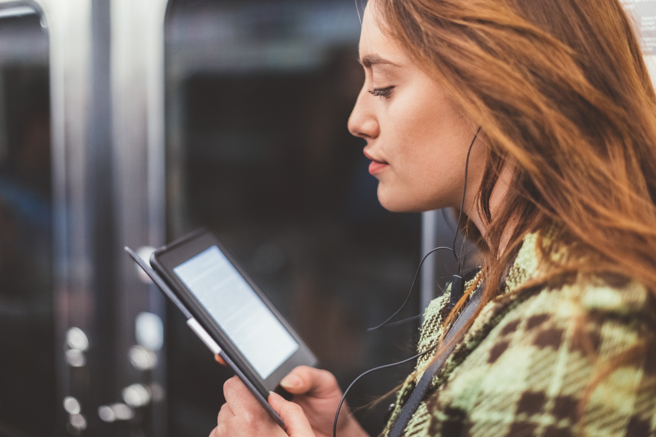 woman reading on tablet