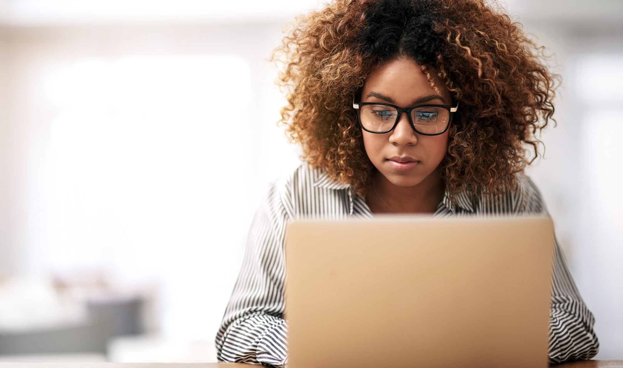 woman works on laptop