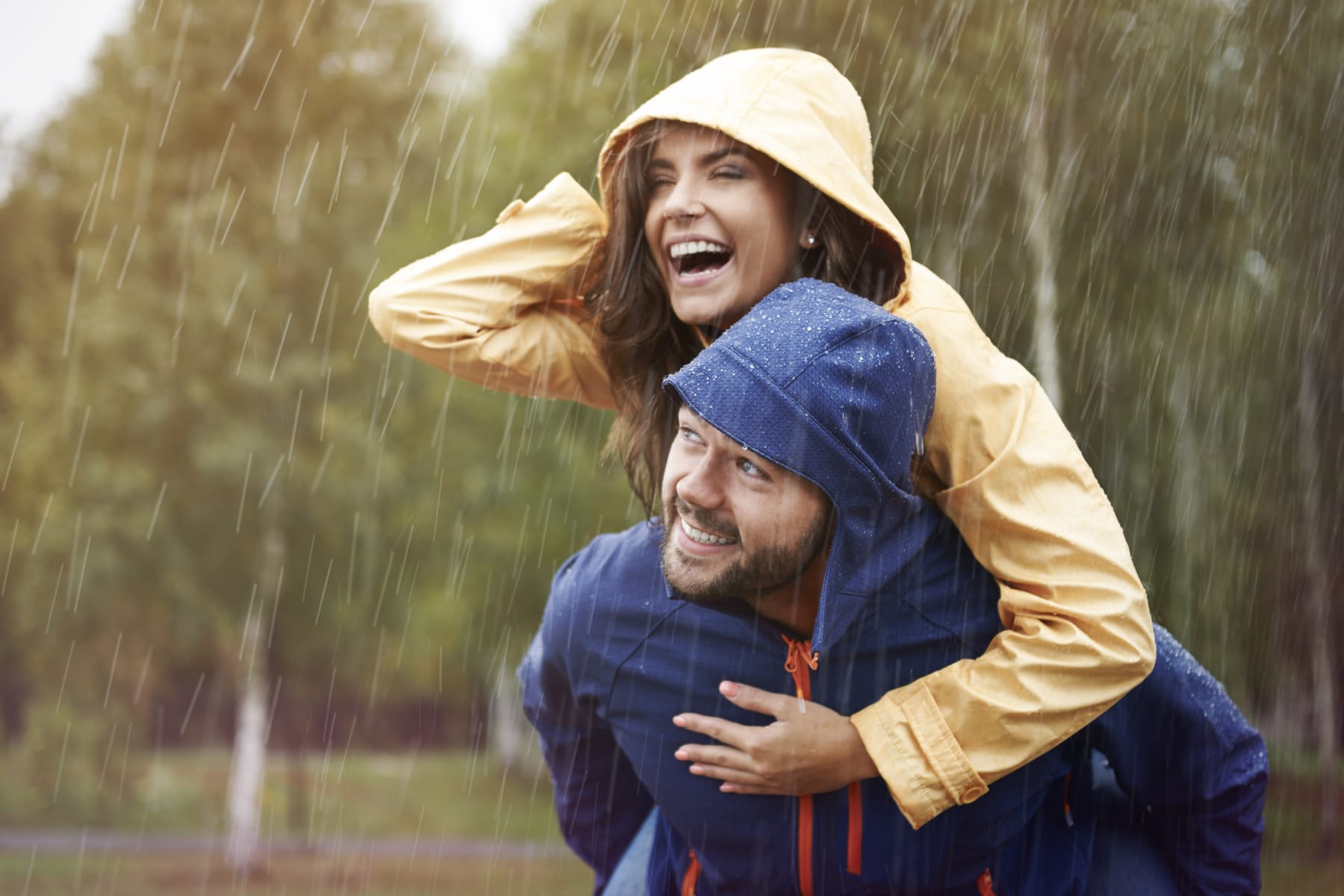 man and woman in rain