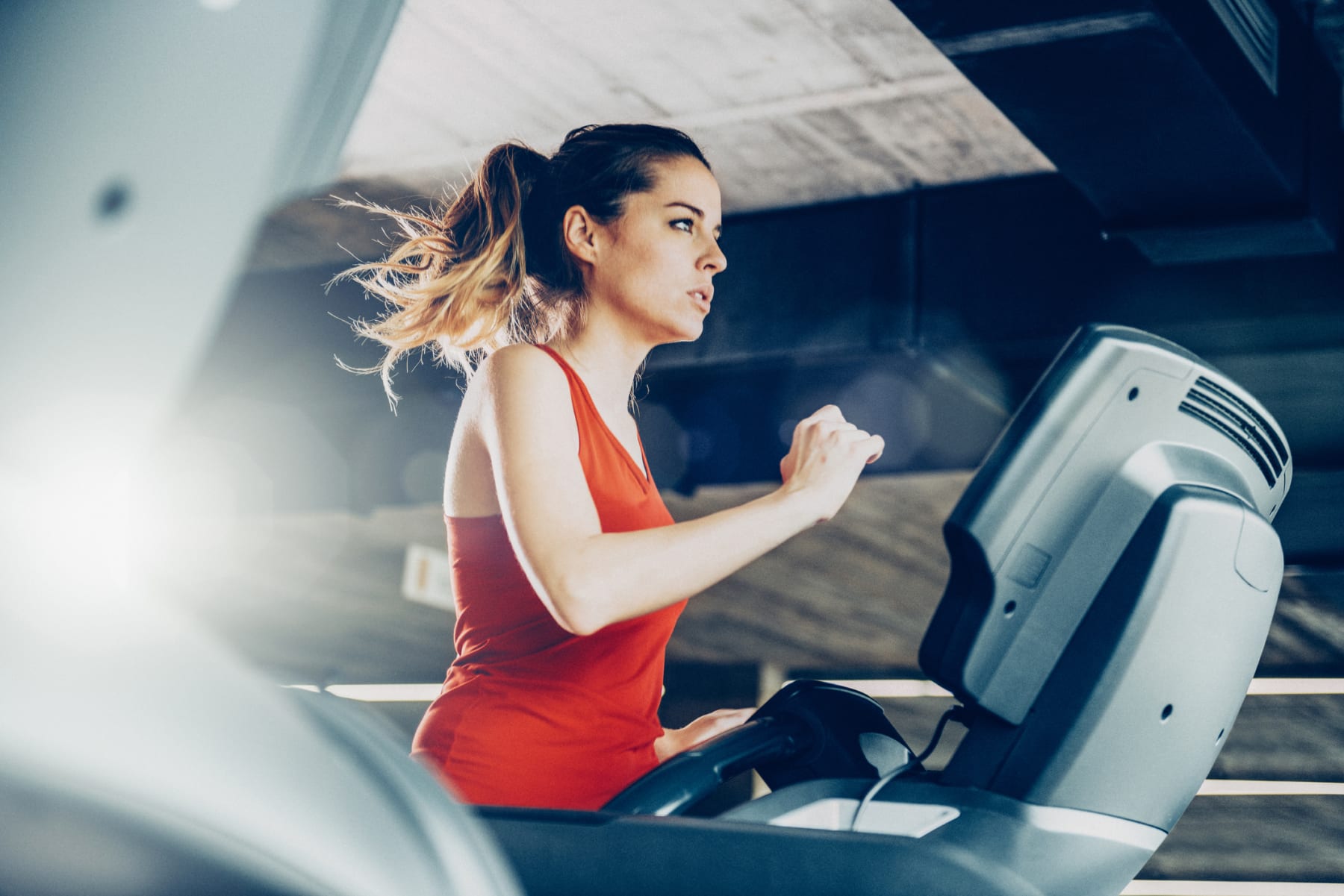 woman runs on treadmill