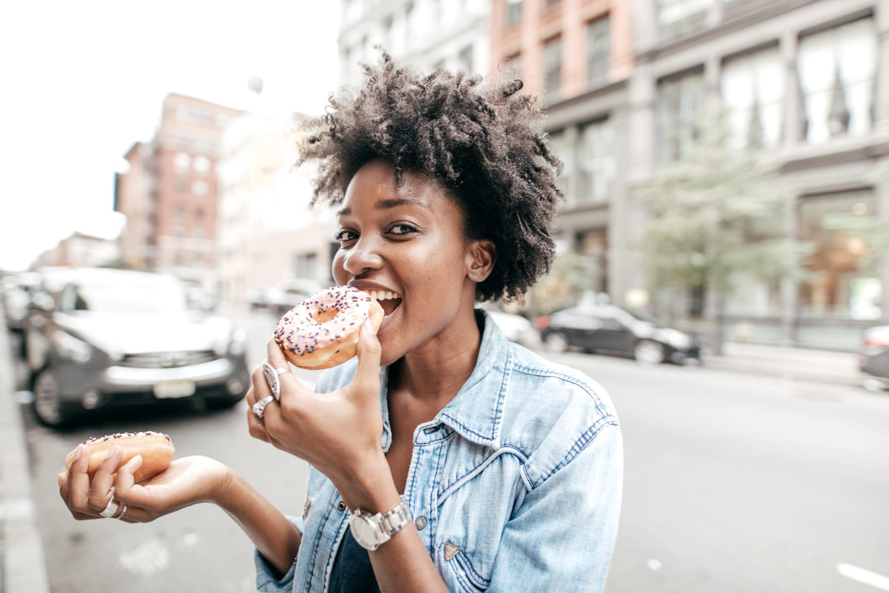 Woman Eating Donuts